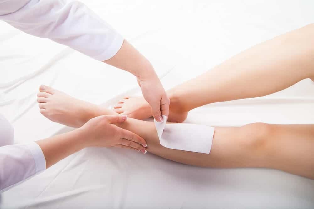 Photo of a leg being waxed