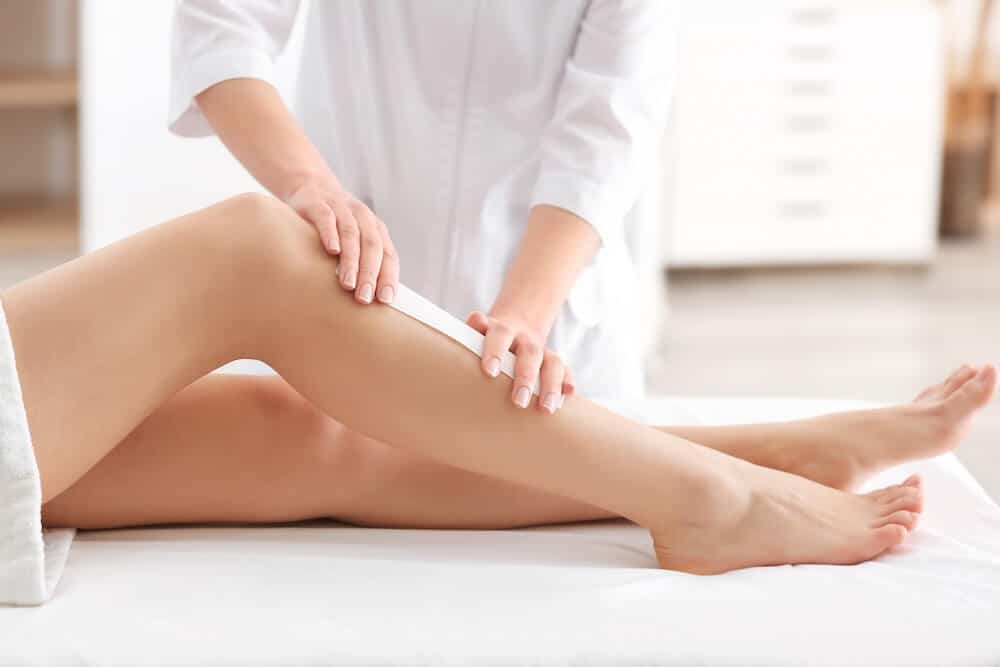 Photo of a leg being waxed